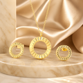 The Ruth Set jewelry set on a beige fabric background